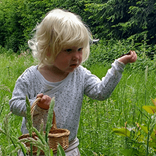 Nature Play young child exploring nature